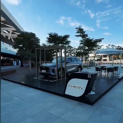 Outdoor car display activation at an airport forecourt